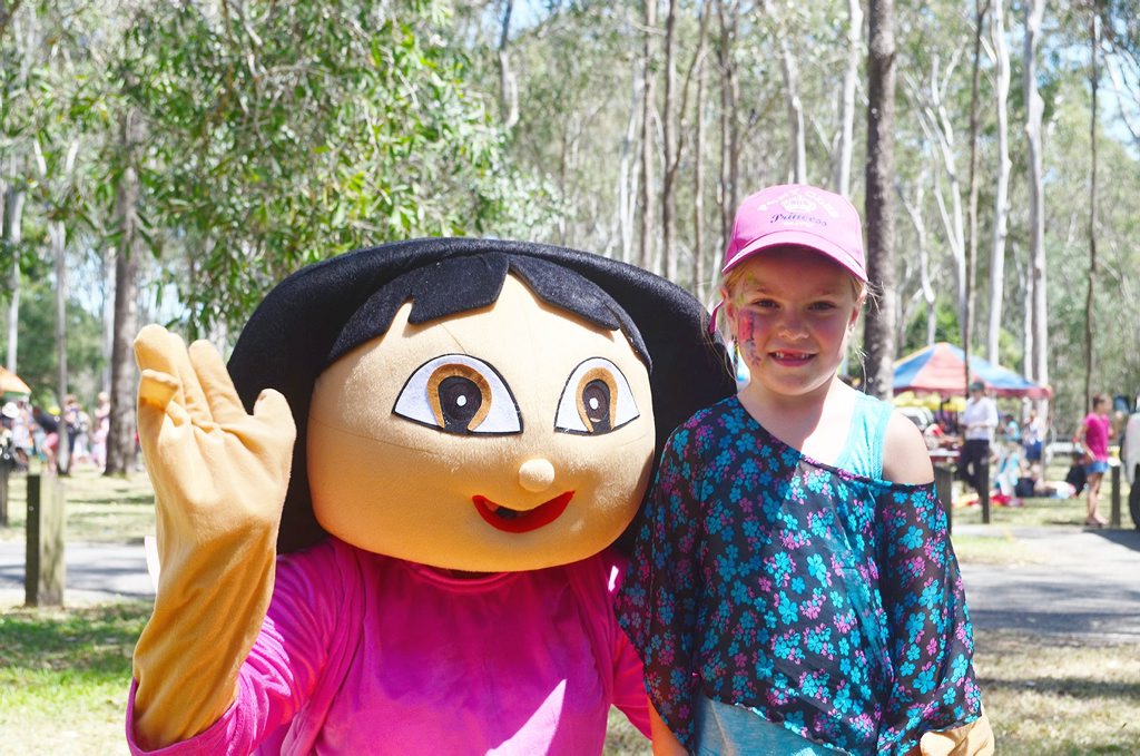 Lara Hunt was happy to jump into a photograph with Dora the Explorer at the Gladstone Tondoon Botanic Gardens Family Fun Day on October 6, 2013. Photo Contributed Lara Hunt was happy to jump into a photograph with Dora the Explorer at the Gladstone Tondoon Botanic Gardens Family Fun Day on October 6, 2013. Photo Contributed